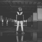 man standing on ground near column