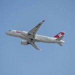 a large passenger jet flying through a blue sky