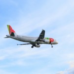 white and red airliner
