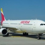 white and red air plane on airport during daytime