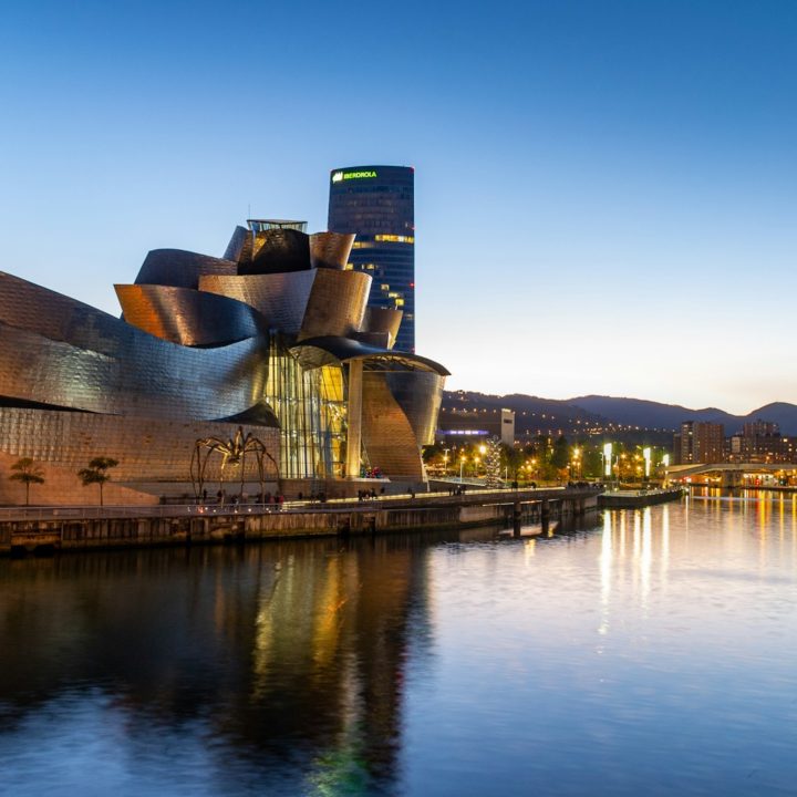a large building next to a body of water