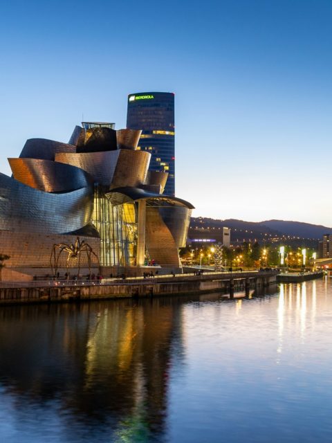 a large building next to a body of water