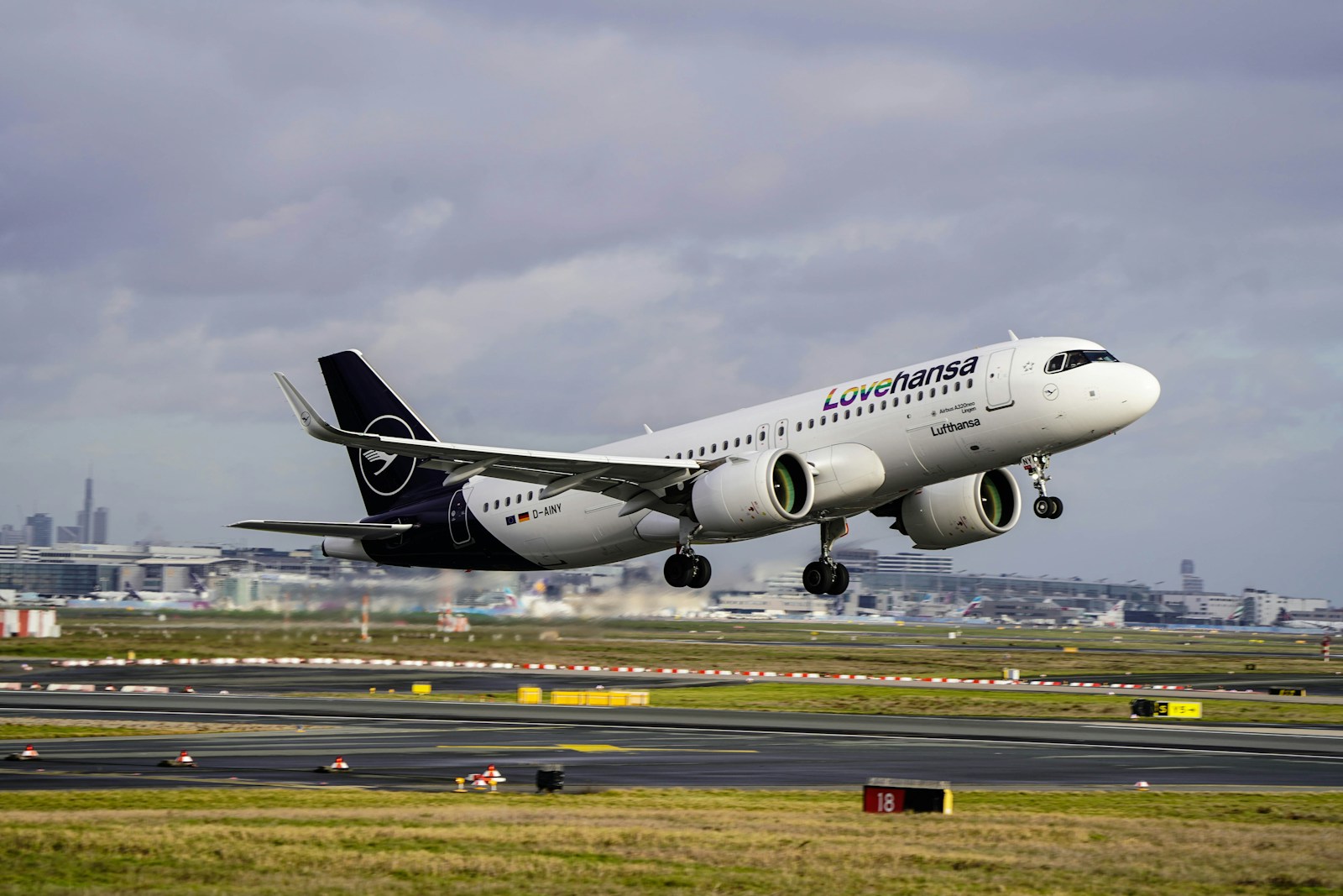 a large jetliner taking off from an airport runway
