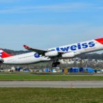 A large jetliner taking off from an airport runway