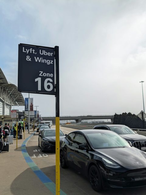 A car parked in front of an airport