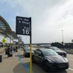 A car parked in front of an airport
